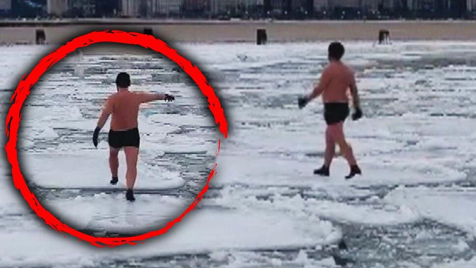 Man in Swim Trunks Walks Across Pancake Ice
