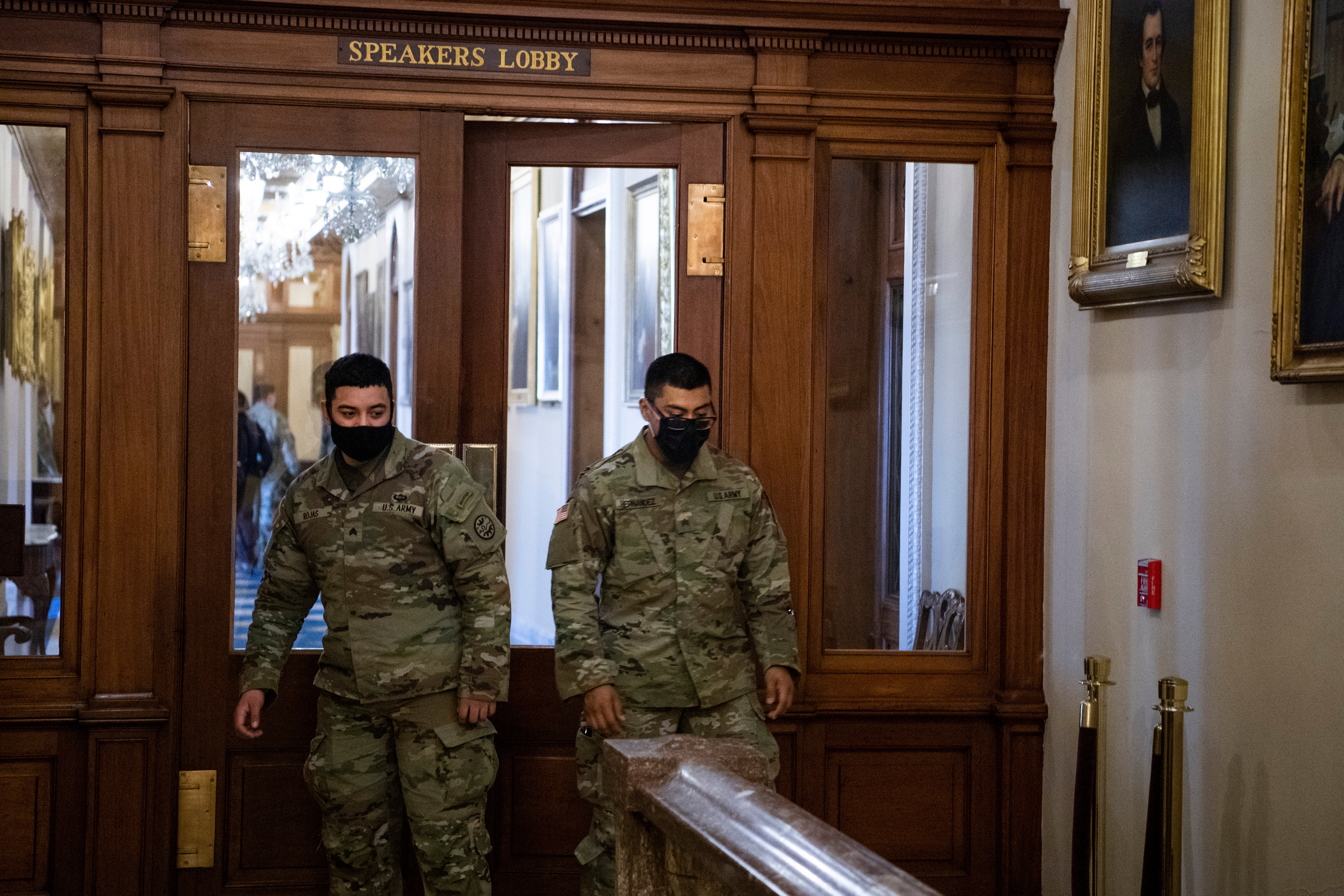 Members of the National Guard are seen in the Speakers Lobby at the door where Ashli Babbitt was killed during the Capitol riot, while troops toured the Capitol on Monday, January 25, 2021.