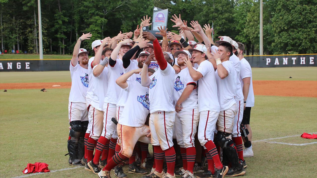 Team posing for selfies after win