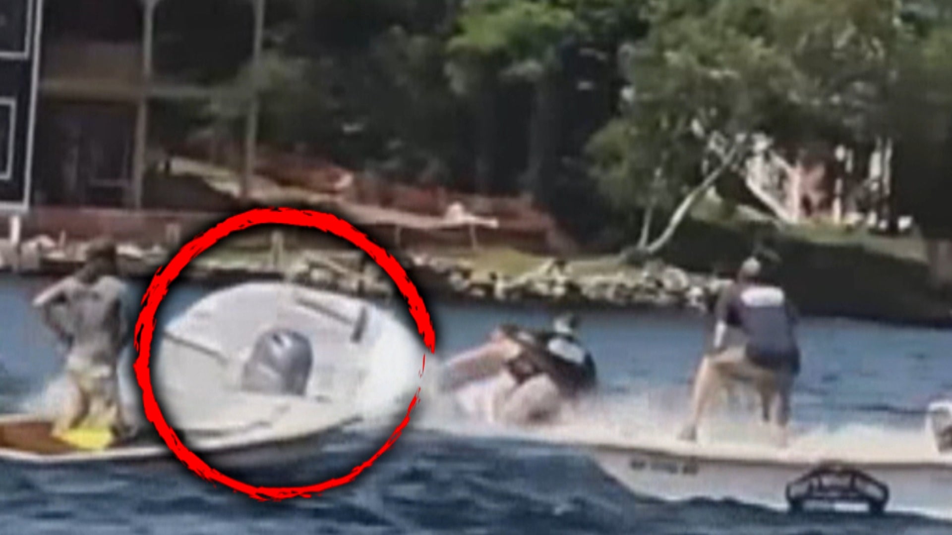 Brady Procon jumping from a jet ski onto a motorboat.