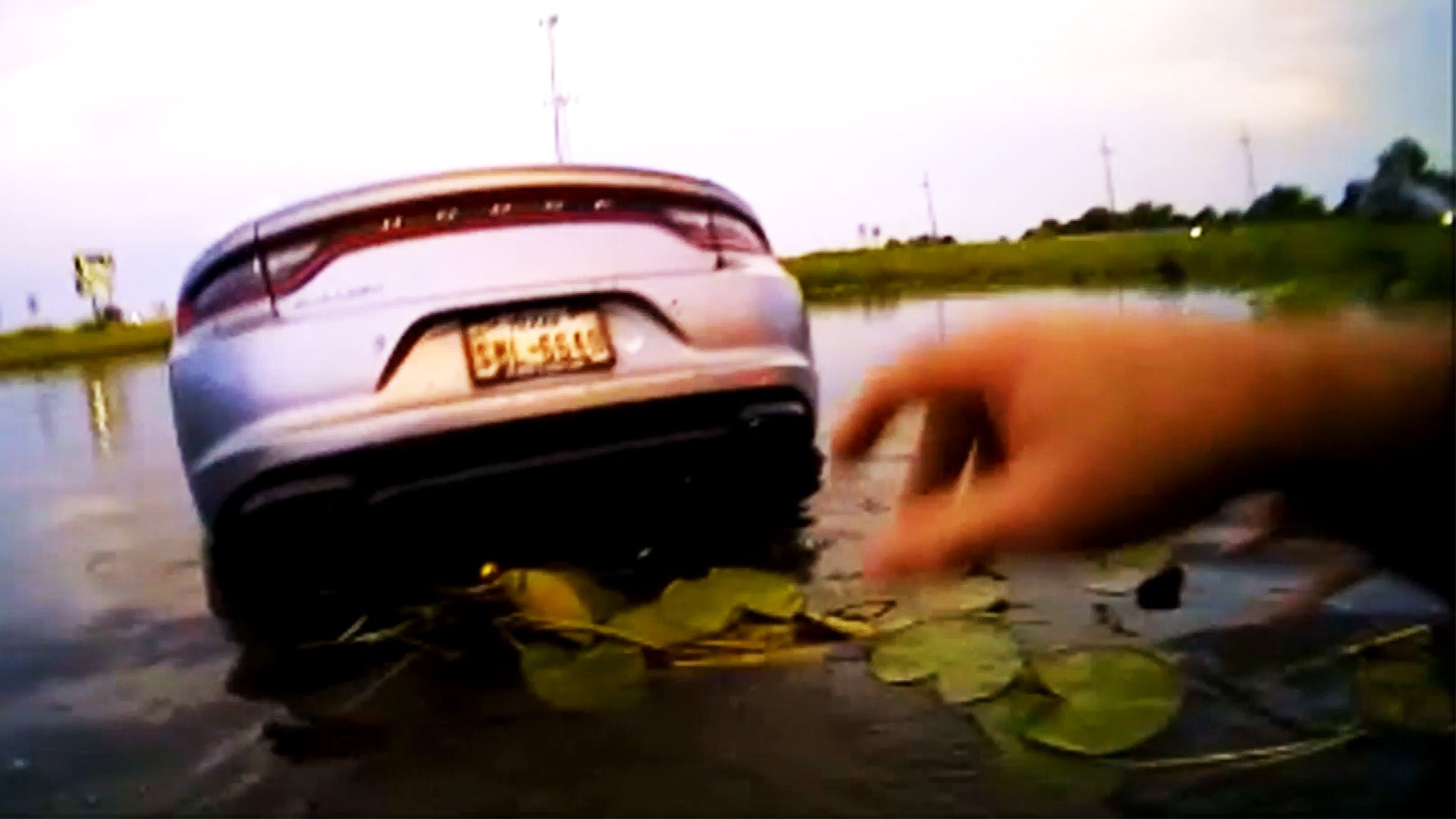 Car submerged in pond