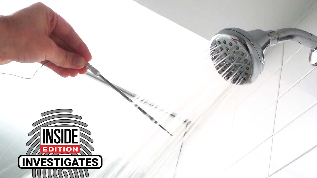 Temperature of water from shower head being measured