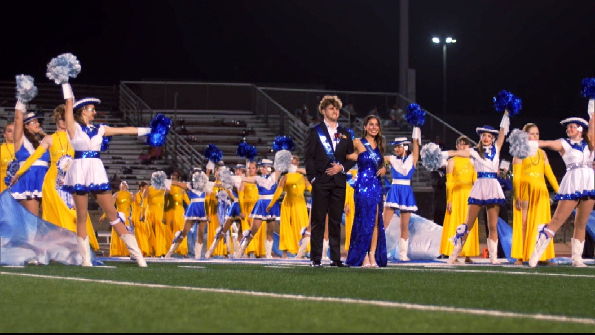 Teen Crowned Homecoming Duchess Cheers With Squad in Gown