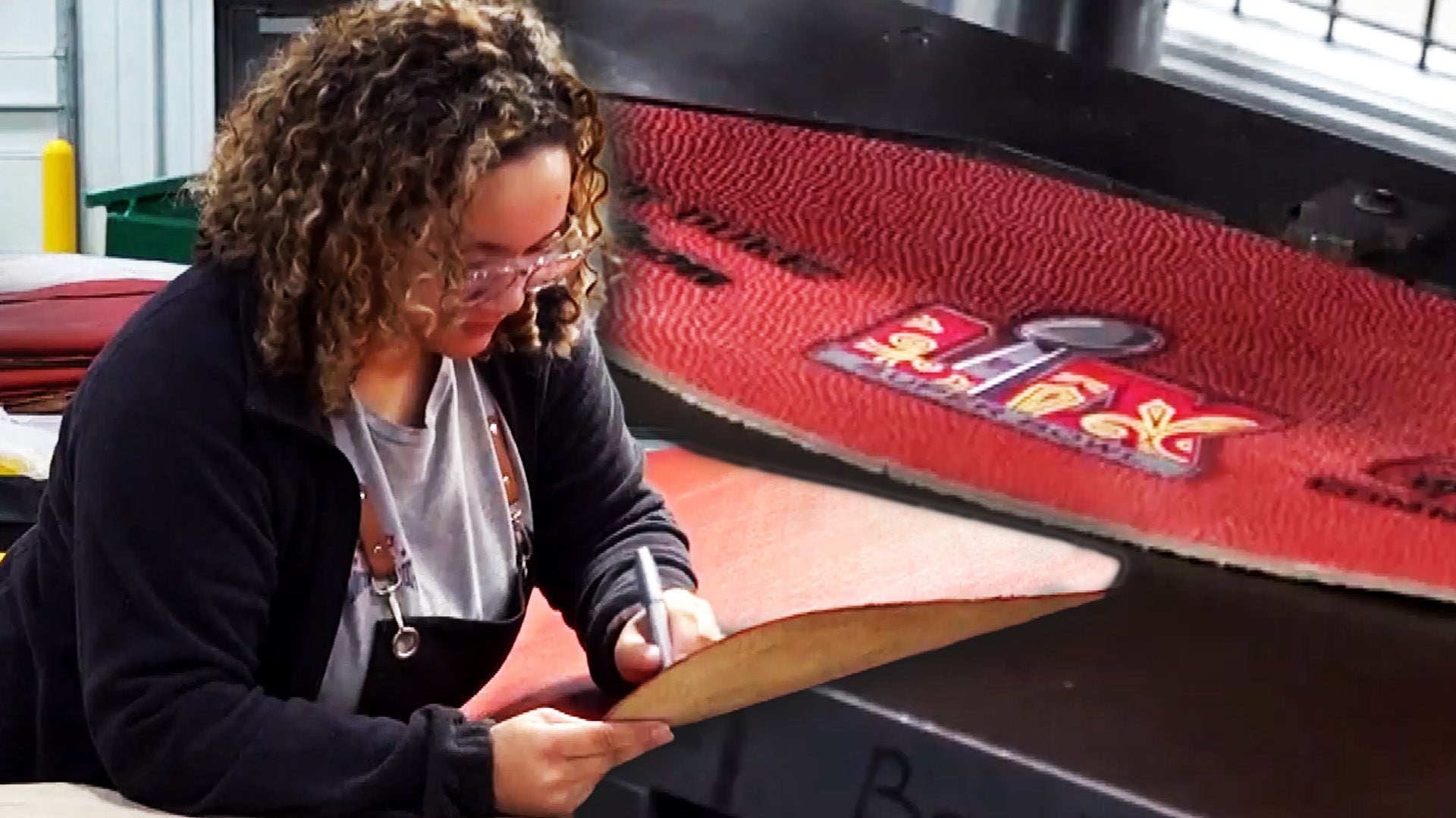 Woman working with leather, part of Super Bowl football