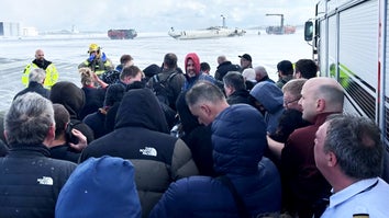 Plane Passengers Huddle Together After Escaping Flipped Delta Flight in Toronto