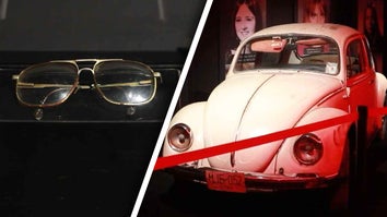 Eyeglasses, Volkswagen Beetle behind red rope