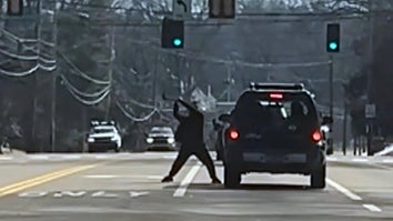 Shocking video shows a Tennessee driver attacking a couple's car with an ax.