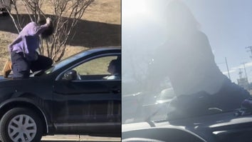 Woman on Car During Road Rage Incident