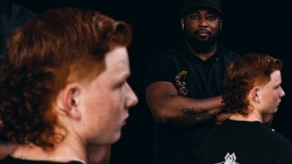 Close up of Tyler Billingsley's, 16, mullet; Robb Cherry, owner of Eleven 01 Barber Lounge with Billingsley.