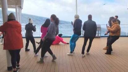 people standing on boat