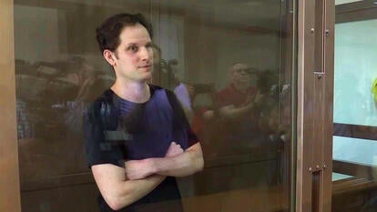 Journalist Evan Gershkovich in defendant's cage in Russian court