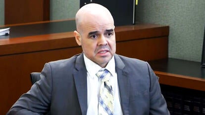 Politician accused of murder takes stand