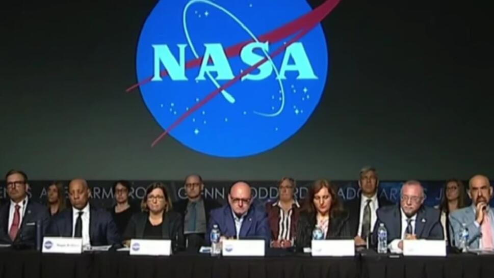 people working for NASAsitting at table