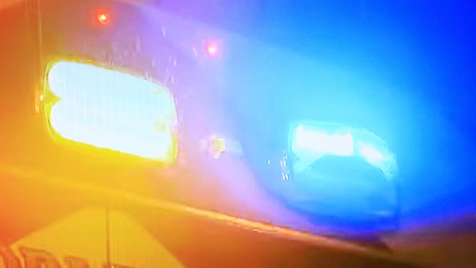 Illuminated strobe lights on the back of a ambulance