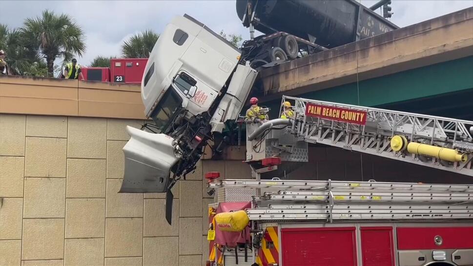 18-wheel tractor trailer dangles.