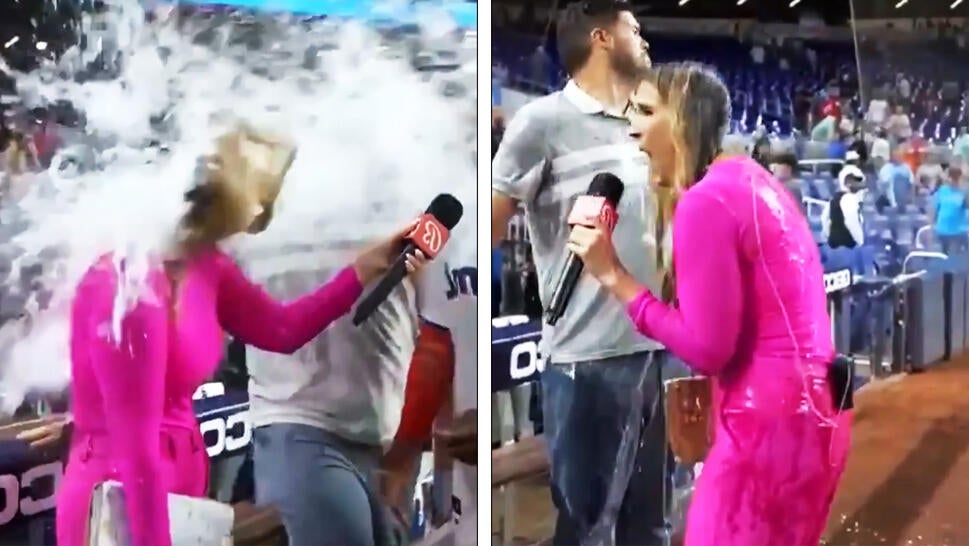 Reporter Jess Blaylock gets drenched with water