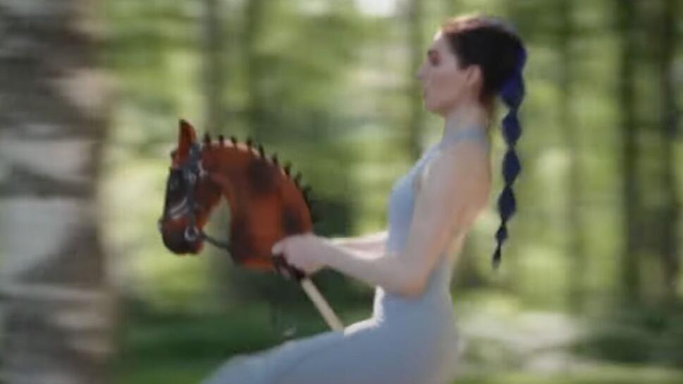 person riding stick horse