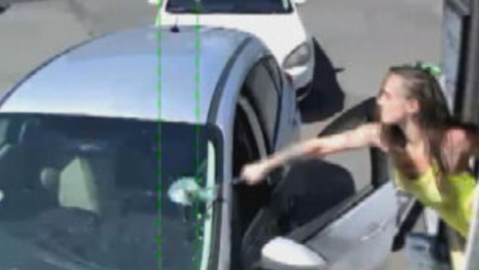barista smashes car window with hammer