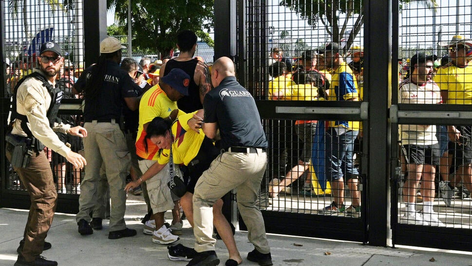 Security personnel detain Colombia's supporters that tried to get into the stadium without tickets ahead of the Conmebol 2024 Copa America tournament final football match between Argentina and Colombia at the Hard Rock Stadium, in Miami, Florida on July 14, 2024.