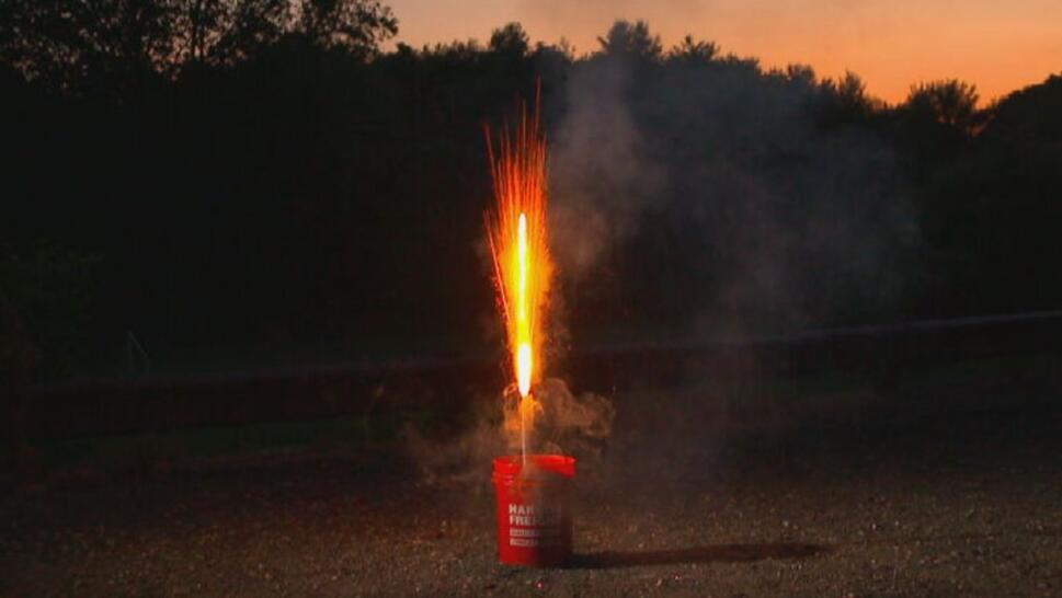 roman candle being lit from bucket