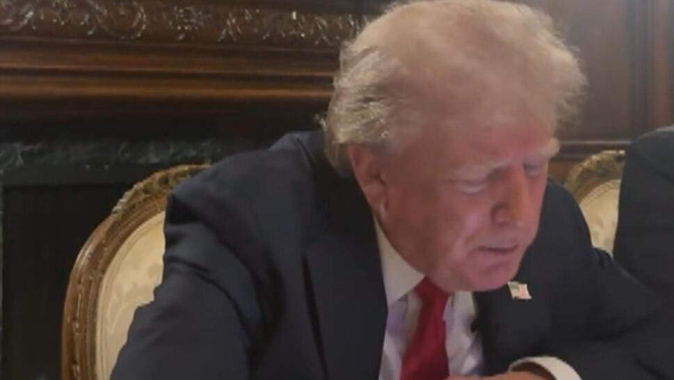 Trump on phone during Elon Musk Interview