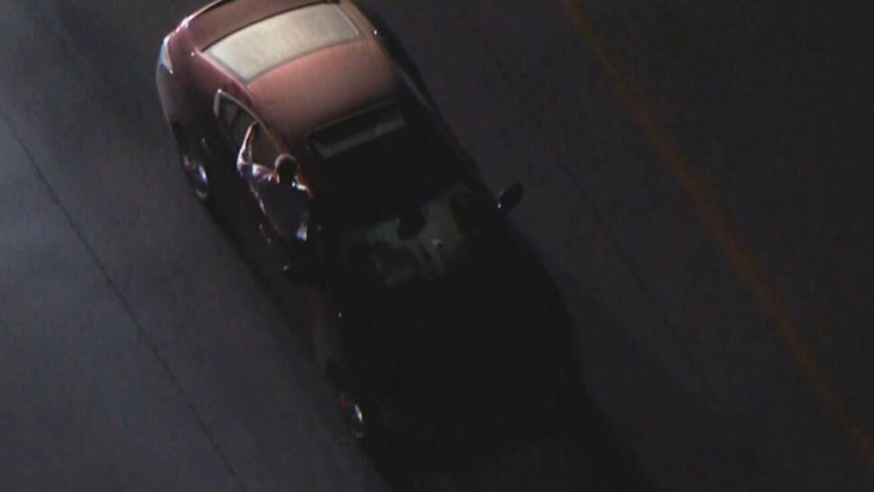 Man Sticks Out the Window During Police Pursuit 