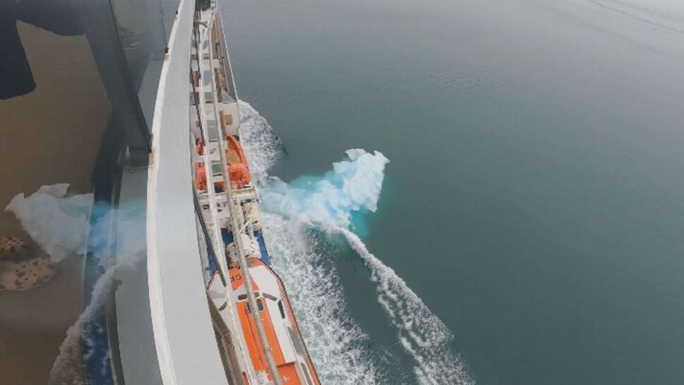 chunck of ice in water off the side of ship